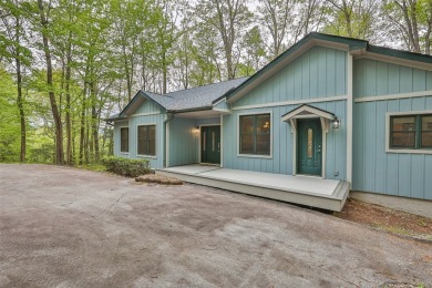 Nestled in the popular Holly Forest community of Sapphire, this on Sapphire National Golf Club in North Carolina - for sale on GolfHomes.com, golf home, golf lot