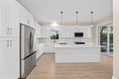 Reimagined and move-in ready, this waterfront home on an on The Legacy Golf and Tennis Club in Florida - for sale on GolfHomes.com, golf home, golf lot