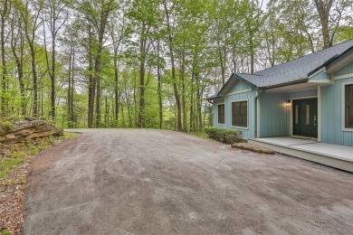 Nestled in the popular Holly Forest community of Sapphire, this on Sapphire National Golf Club in North Carolina - for sale on GolfHomes.com, golf home, golf lot