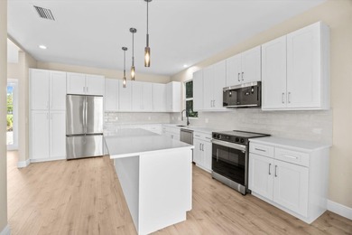 Reimagined and move-in ready, this waterfront home on an on The Legacy Golf and Tennis Club in Florida - for sale on GolfHomes.com, golf home, golf lot