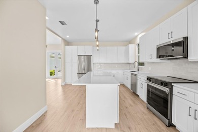 Reimagined and move-in ready, this waterfront home on an on The Legacy Golf and Tennis Club in Florida - for sale on GolfHomes.com, golf home, golf lot