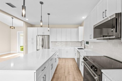 Reimagined and move-in ready, this waterfront home on an on The Legacy Golf and Tennis Club in Florida - for sale on GolfHomes.com, golf home, golf lot