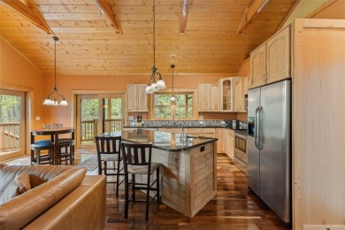 Nestled in the popular Holly Forest community of Sapphire, this on Sapphire National Golf Club in North Carolina - for sale on GolfHomes.com, golf home, golf lot