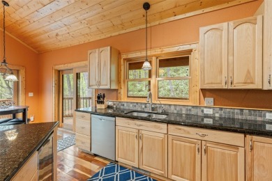 Nestled in the popular Holly Forest community of Sapphire, this on Sapphire National Golf Club in North Carolina - for sale on GolfHomes.com, golf home, golf lot