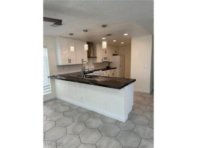 Discover this stunning, renovated home featuring modern quartz on Desert Rose Golf Course in Nevada - for sale on GolfHomes.com, golf home, golf lot
