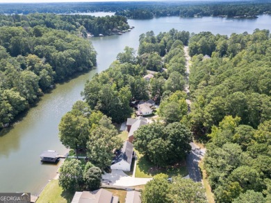 Lakefront Home on Large Level Lot with Covered Dock on Turtle Cove Golf Course in Georgia - for sale on GolfHomes.com, golf home, golf lot