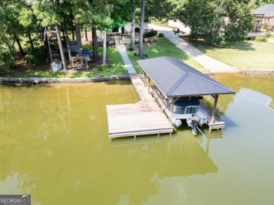 Lakefront Home on Large Level Lot with Covered Dock on Turtle Cove Golf Course in Georgia - for sale on GolfHomes.com, golf home, golf lot