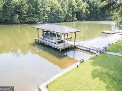 Lakefront Home on Large Level Lot with Covered Dock on Turtle Cove Golf Course in Georgia - for sale on GolfHomes.com, golf home, golf lot