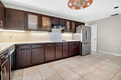 One or more photo(s) has been virtually staged. Tucked into a on Country Club of Mount Dora in Florida - for sale on GolfHomes.com, golf home, golf lot