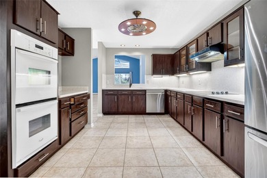 One or more photo(s) has been virtually staged. Tucked into a on Country Club of Mount Dora in Florida - for sale on GolfHomes.com, golf home, golf lot