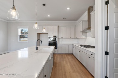 Introducing The Emmy - what a perfect name for a luxury on Brunswick Plantation and Golf Resorts in North Carolina - for sale on GolfHomes.com, golf home, golf lot