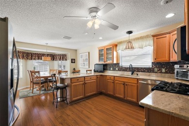 Located in the desirable Village of Sunset Pointe, this updated on The Links of Spruce Creek in Florida - for sale on GolfHomes.com, golf home, golf lot