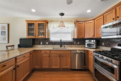 Located in the desirable Village of Sunset Pointe, this updated on The Links of Spruce Creek in Florida - for sale on GolfHomes.com, golf home, golf lot