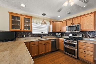 Located in the desirable Village of Sunset Pointe, this updated on The Links of Spruce Creek in Florida - for sale on GolfHomes.com, golf home, golf lot