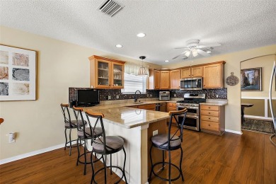 Located in the desirable Village of Sunset Pointe, this updated on The Links of Spruce Creek in Florida - for sale on GolfHomes.com, golf home, golf lot
