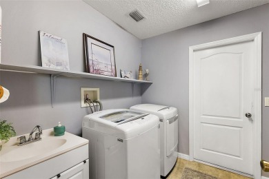 Located in the desirable Village of Sunset Pointe, this updated on The Links of Spruce Creek in Florida - for sale on GolfHomes.com, golf home, golf lot