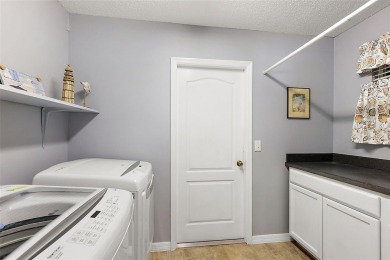 Located in the desirable Village of Sunset Pointe, this updated on The Links of Spruce Creek in Florida - for sale on GolfHomes.com, golf home, golf lot