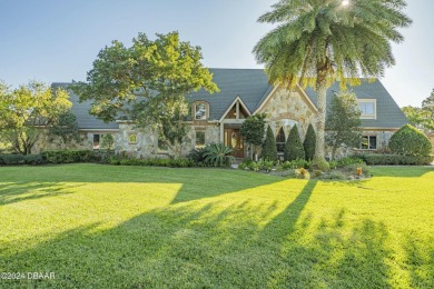 Nestled on a beautifully landscaped 0.65-acre lot, this on Plantation Bay Golf and Country Club in Florida - for sale on GolfHomes.com, golf home, golf lot