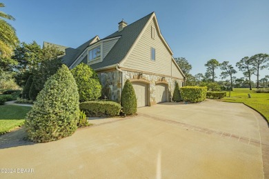 Nestled on a beautifully landscaped 0.65-acre lot, this on Plantation Bay Golf and Country Club in Florida - for sale on GolfHomes.com, golf home, golf lot