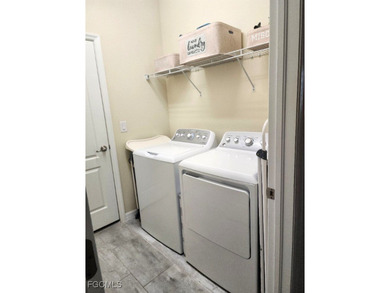 Charming 3-Bedroom, 3-Bath Lake View Home with Assumable FHA on River Hall Country Club in Florida - for sale on GolfHomes.com, golf home, golf lot