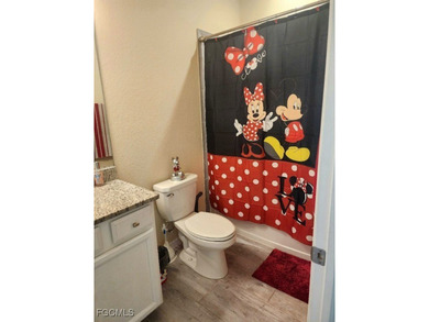 Charming 3-Bedroom, 3-Bath Lake View Home with Assumable FHA on River Hall Country Club in Florida - for sale on GolfHomes.com, golf home, golf lot