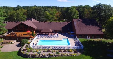 Discover the epitome of convenience and comfort in this on Michaywe Pines Course in Michigan - for sale on GolfHomes.com, golf home, golf lot