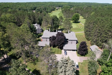 Discover the epitome of convenience and comfort in this on Michaywe Pines Course in Michigan - for sale on GolfHomes.com, golf home, golf lot