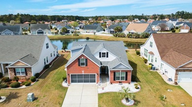 Enjoy stunning views of a serene pond from this beautifully on Palmetto Greens Golf and Country Club in South Carolina - for sale on GolfHomes.com, golf home, golf lot