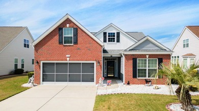 Enjoy stunning views of a serene pond from this beautifully on Palmetto Greens Golf and Country Club in South Carolina - for sale on GolfHomes.com, golf home, golf lot