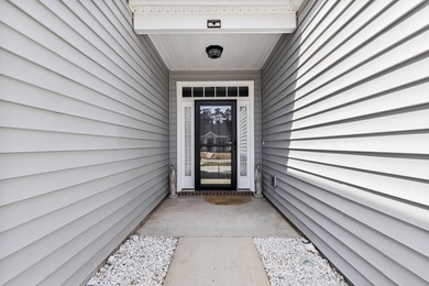 Enjoy stunning views of a serene pond from this beautifully on Palmetto Greens Golf and Country Club in South Carolina - for sale on GolfHomes.com, golf home, golf lot