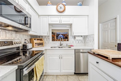Beautifully updated 1,421 square foot home that features an on Tampa Bay Golf and Country Club in Florida - for sale on GolfHomes.com, golf home, golf lot