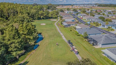 Beautifully updated 1,421 square foot home that features an on Tampa Bay Golf and Country Club in Florida - for sale on GolfHomes.com, golf home, golf lot