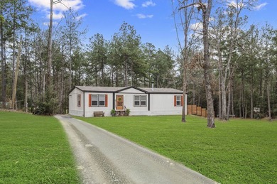 Modern Elegance meets Southern Comfort in this pristine 2022 on Rayburn Country Club in Texas - for sale on GolfHomes.com, golf home, golf lot