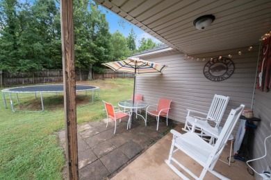 This charming, well-maintained 3 bedroom, 2 bath home is nestled on Silver Springs Country Club in Arkansas - for sale on GolfHomes.com, golf home, golf lot
