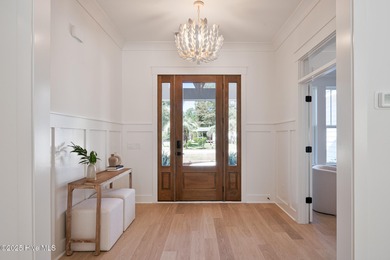 Welcome to your ideal coastal retreat! This beautiful 1.5 story on Crow Creek Golf Club in North Carolina - for sale on GolfHomes.com, golf home, golf lot