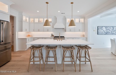 Welcome to your ideal coastal retreat! This beautiful 1.5 story on Crow Creek Golf Club in North Carolina - for sale on GolfHomes.com, golf home, golf lot