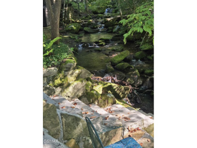 Absolutely beautiful creek front lot with a concrete deck and on Bent Creek Golf Course in Tennessee - for sale on GolfHomes.com, golf home, golf lot