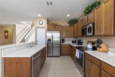 This 4-bed plus den, 2.5-bath two-story residence in Valencia on Valencia Golf and Country Club in Florida - for sale on GolfHomes.com, golf home, golf lot