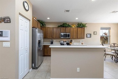 This 4-bed plus den, 2.5-bath two-story residence in Valencia on Valencia Golf and Country Club in Florida - for sale on GolfHomes.com, golf home, golf lot