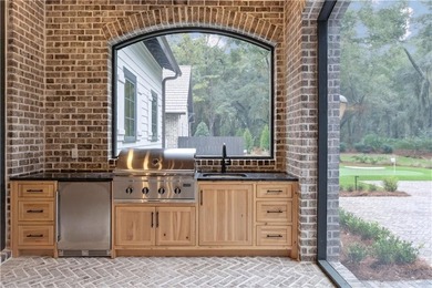 Incredible golf course, lake, and marsh views from one of the on Frederica Golf Club in Georgia - for sale on GolfHomes.com, golf home, golf lot