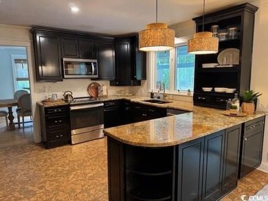 Welcome to this inviting two-story home situated on nearly an on The Founders Club At Pawleys Island in South Carolina - for sale on GolfHomes.com, golf home, golf lot