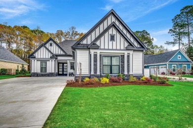 Discover an exquisite blend of style and modern convenience at on Wild Wing Plantation in South Carolina - for sale on GolfHomes.com, golf home, golf lot