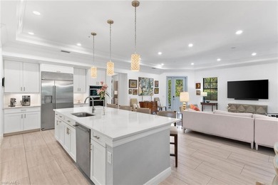 Coastal first-floor end unit with no neighboring building next on Windstar on Naples Bay in Florida - for sale on GolfHomes.com, golf home, golf lot