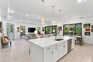 Coastal first-floor end unit with no neighboring building next on Windstar on Naples Bay in Florida - for sale on GolfHomes.com, golf home, golf lot