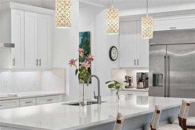 Coastal first-floor end unit with no neighboring building next on Windstar on Naples Bay in Florida - for sale on GolfHomes.com, golf home, golf lot