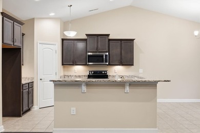 Welcome home! Tucked away in the quiet, low-HOA North Village on Palmetto Greens Golf and Country Club in South Carolina - for sale on GolfHomes.com, golf home, golf lot