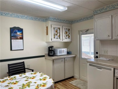 This spacious corner-lot home in Old Bridge Village, a vibrant on Riverbend Golf and Country Club in Florida - for sale on GolfHomes.com, golf home, golf lot