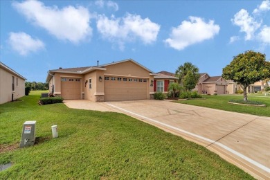 Step inside and be greeted by sweeping golf course views from on Summerglen Country Club in Florida - for sale on GolfHomes.com, golf home, golf lot