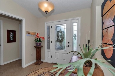 Step inside and be greeted by sweeping golf course views from on Summerglen Country Club in Florida - for sale on GolfHomes.com, golf home, golf lot