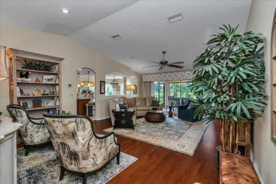 Step inside and be greeted by sweeping golf course views from on Summerglen Country Club in Florida - for sale on GolfHomes.com, golf home, golf lot